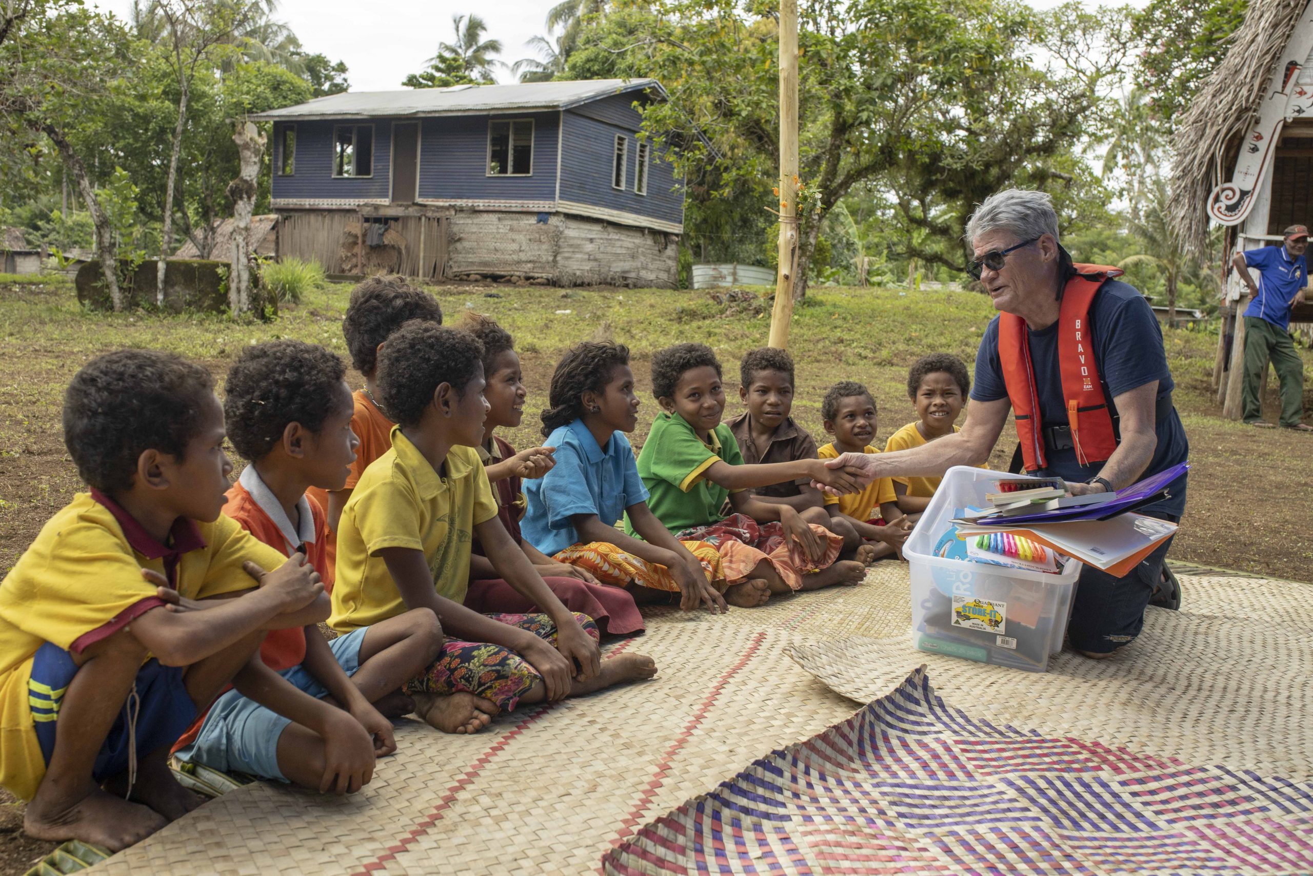 Agent Image Gallery 114 Tourist Donating Pens and Books True North Cruise PNG
